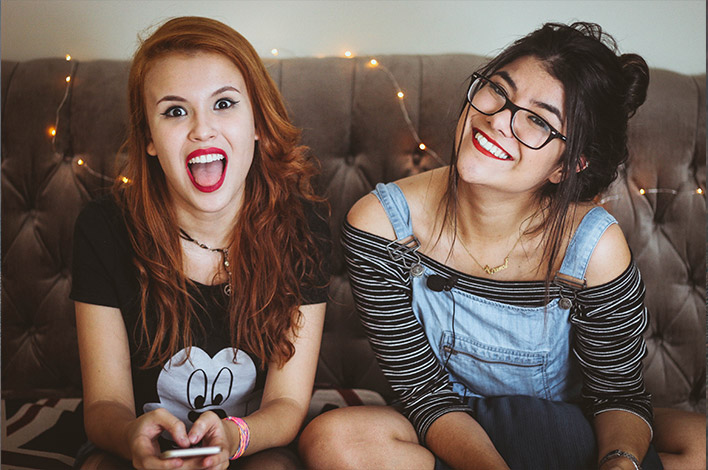 Millennial girls laughing